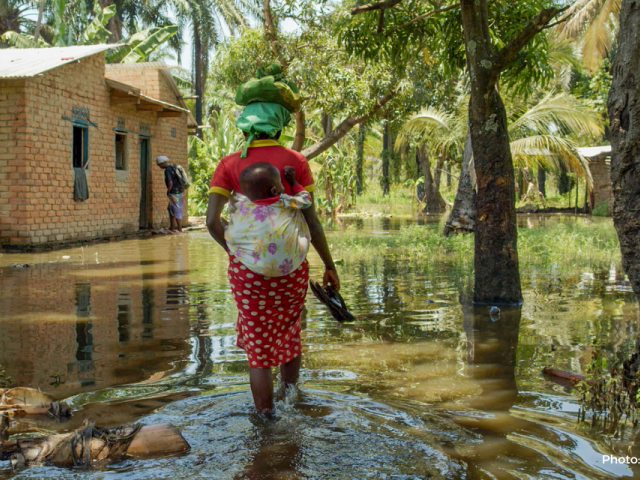 Woman walking through the floods